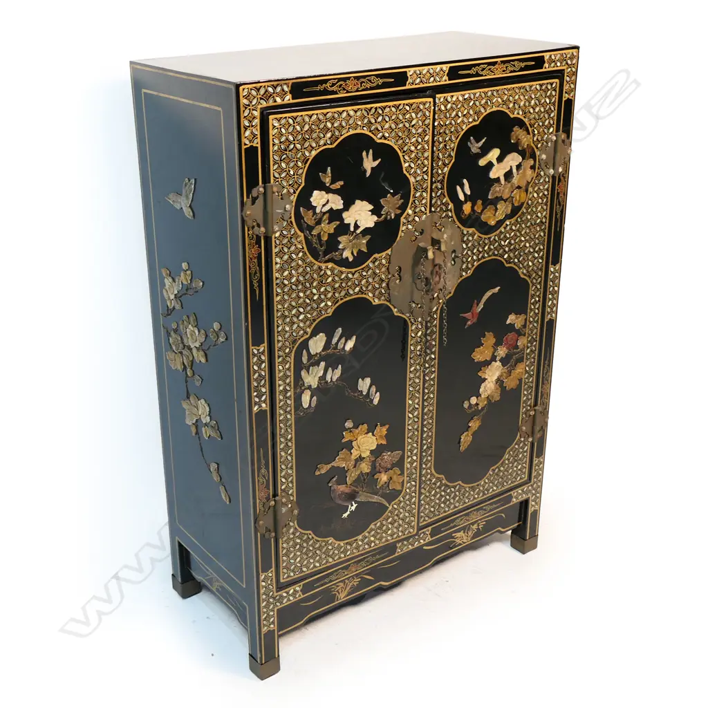 A vintage oriental black lacquer small cupboard with carved coloured stone decoration, Image 1++
