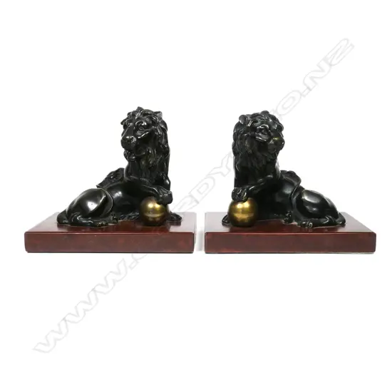 A pair of bronze Imperial lion bookends,
