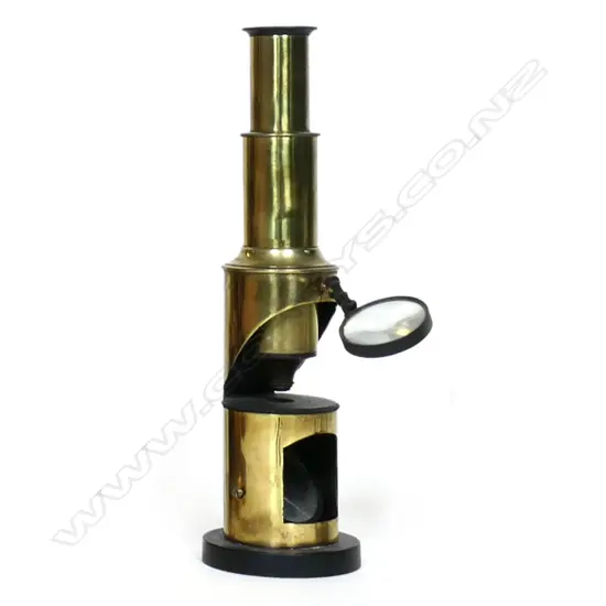 A 19thC brass drum microscope, with cut away tubular body for the stage and mirror, ebonized interior and stage,