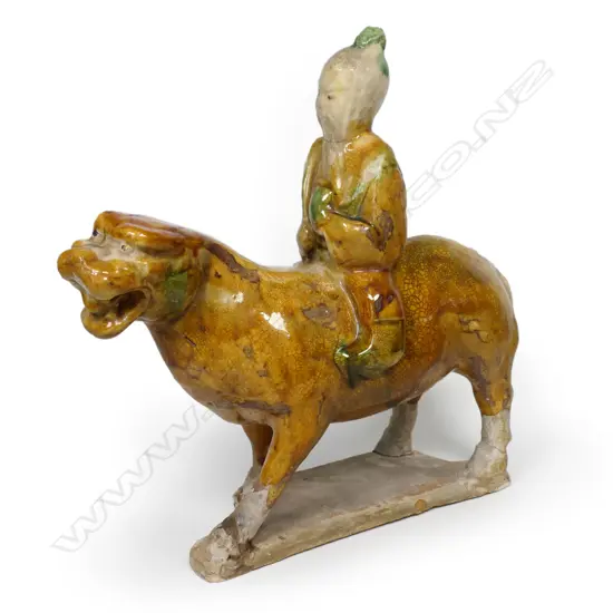 An early and uncommon Chinese sancai glazed tiger and rider, in the style of the Tang Dynasty,