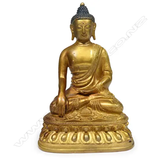 A vintage Oriental gilded bronze Buddha,
