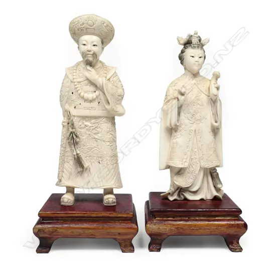A pair of early / mid-20thC Chinese finely carved ivory emperor and empress figurines,