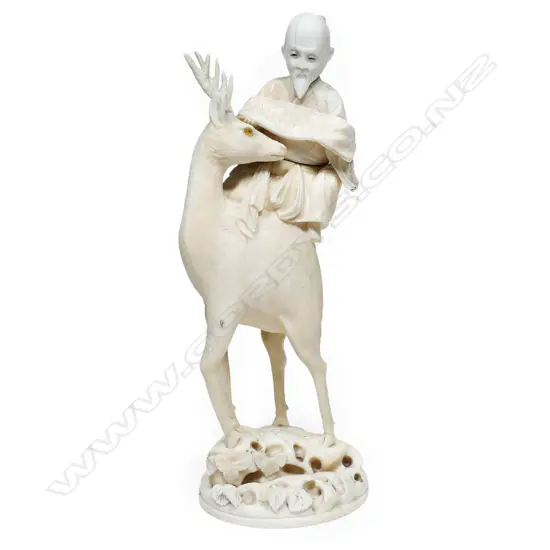 A Chinese carved marine ivory figure group of Shao Lao upon a deer, c.1900