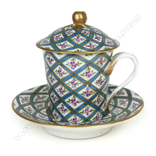 An antique French Sevres porcelain trembleuse chocolate cup and saucer,