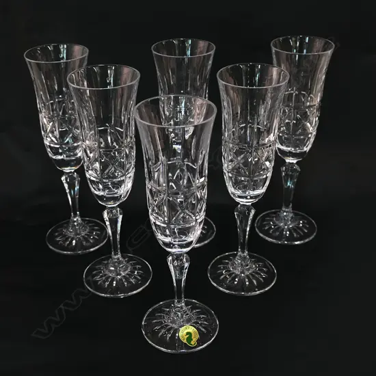 A set of six Waterford crystal champagne flutes,
