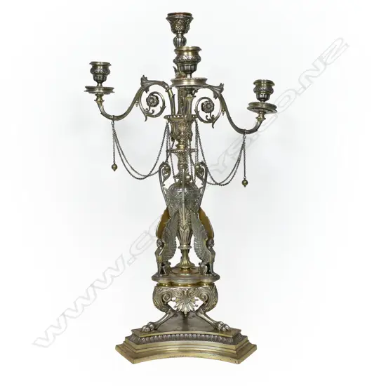A Victorian Egyptian Revival parcel-gilt silver centrepiece candelabra, by Frederick Elkington, probably from a design by Auguste-Adolphe Willms (1827-99) for Elkington & Co, hallmarked Birmingham 1870, Willms was the company's chief designer.
