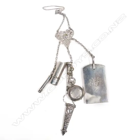 A Victorian silver chatelaine with note pad and sovereign case,