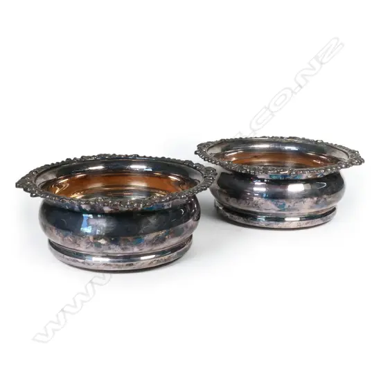 A pair of c.1920s silver plate wine coasters,