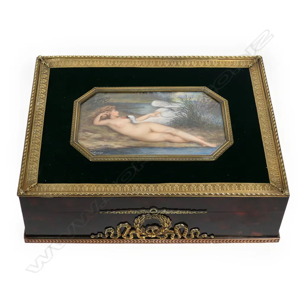 An Asprey’s, London lidded box, with painted ivory panel to the top depicting Leda and the Swan. Image 1++