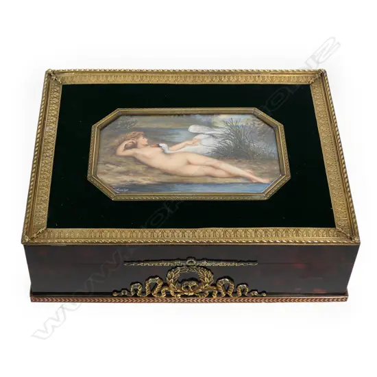 An Asprey’s, London lidded box, with painted ivory panel to the top depicting Leda and the Swan.