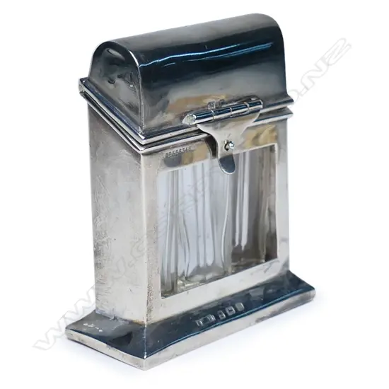 An early 1900s silver perfume bottle holder,