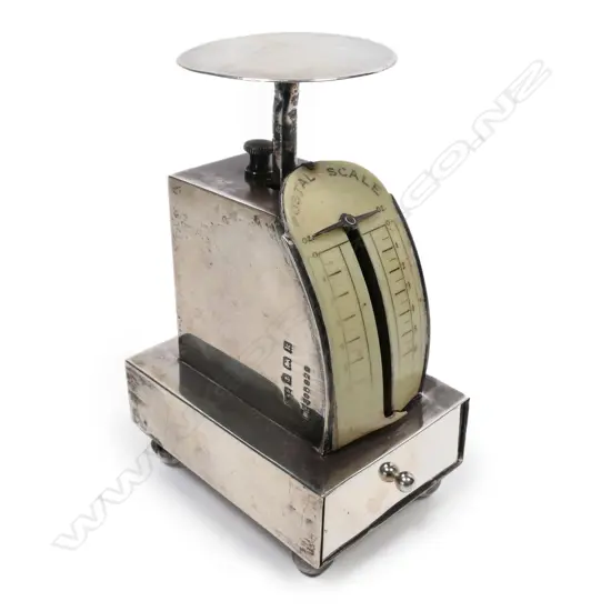 A petite silver postal scale, to weigh 7oz, incorporating a stamp box drawer to the base,