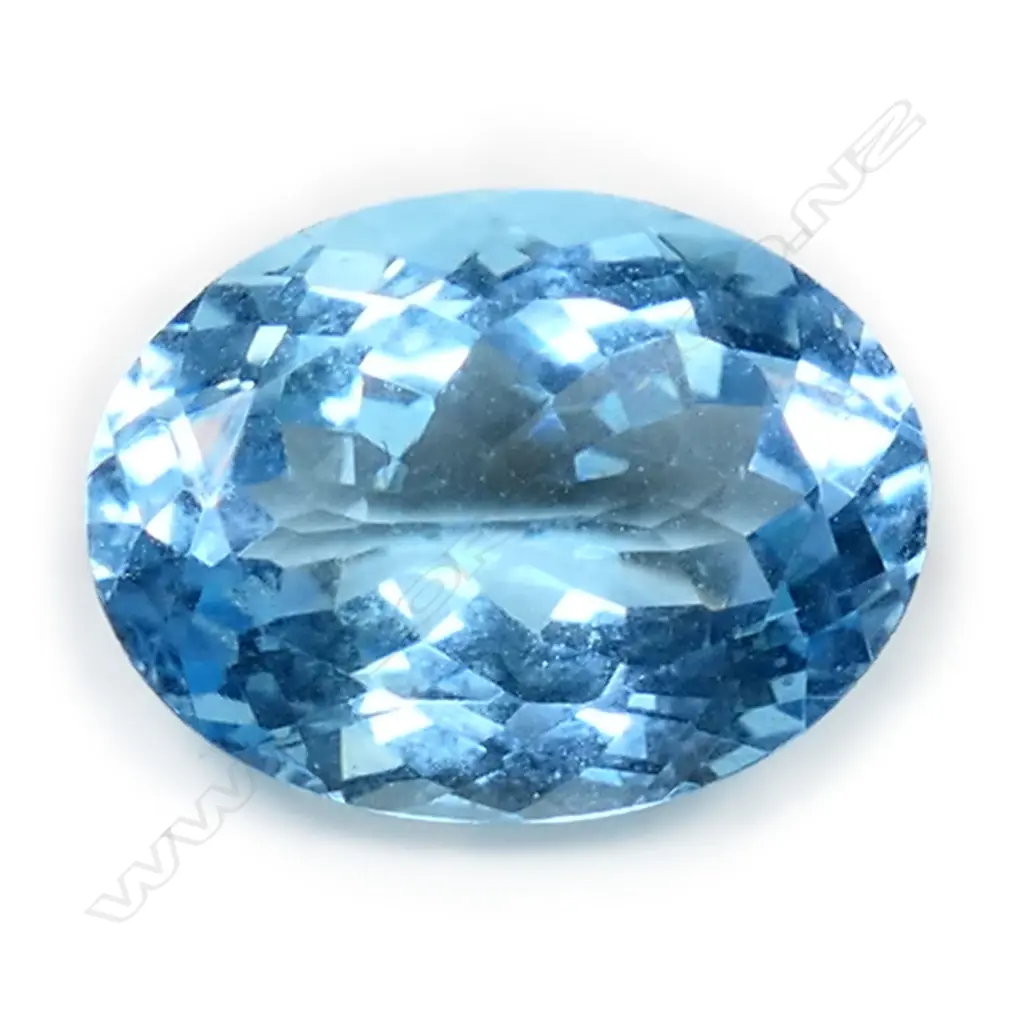 An 11.24ct oval facet cut unset blue topaz, Image 1++