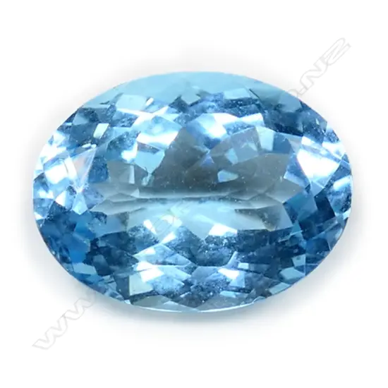 An 11.24ct oval facet cut unset blue topaz,