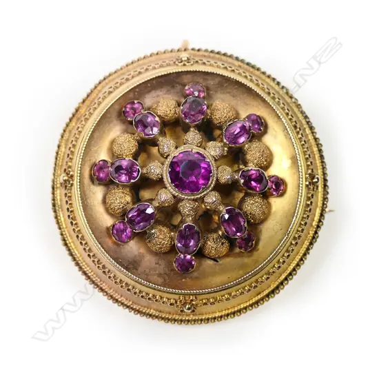 A Victorian 15ct yellow gold almandine garnet target brooch,