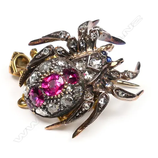 An antique 15ct gold and silver topped gem set spider brooch,