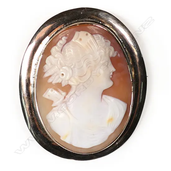 A 9ct rose gold framed elegant cameo brooch,