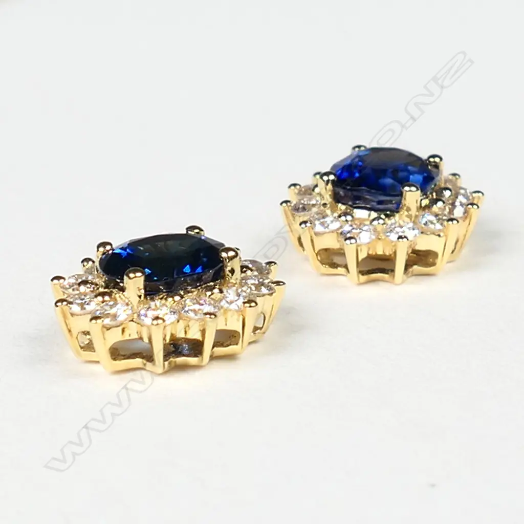 A pair of 18ct yellow gold sapphire and diamond cluster earrings, Image 1++