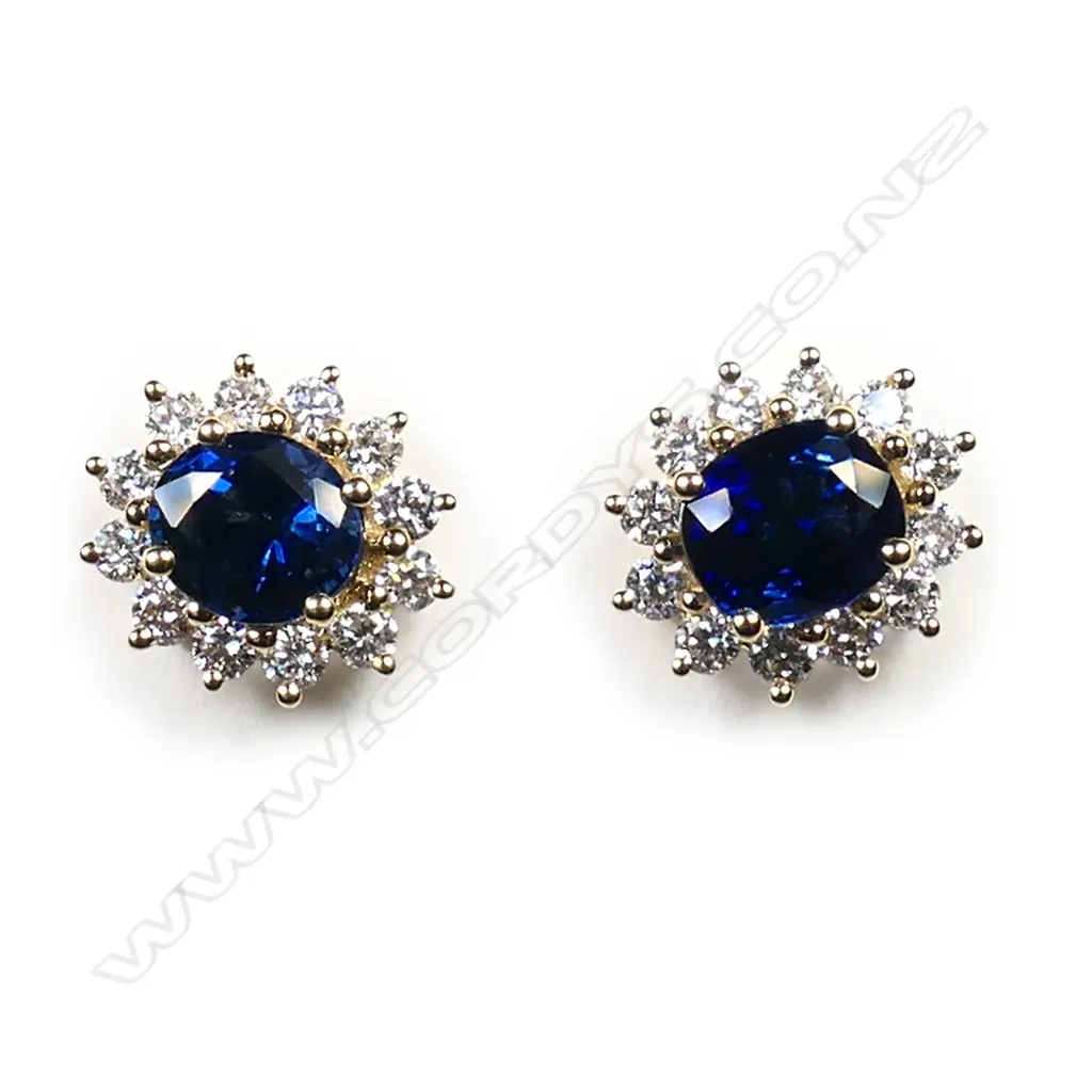A pair of 18ct yellow gold sapphire and diamond cluster earrings, Image 1++