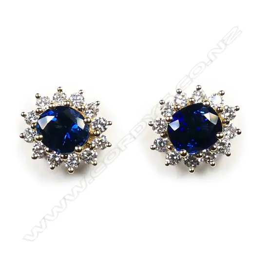 A pair of 18ct yellow gold sapphire and diamond cluster earrings,