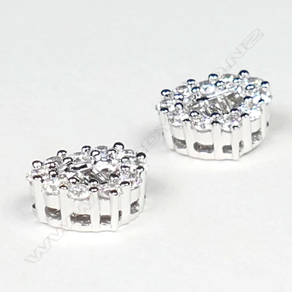 A pair of 18ct white gold and diamond solitaire earrings, Image 1++