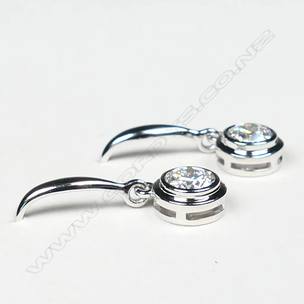 A pair of 18ct white gold and diamond cluster earrings, Image 1++