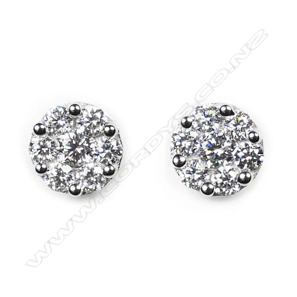 A pair of 18ct white gold and diamond cluster earrings, Image 1++