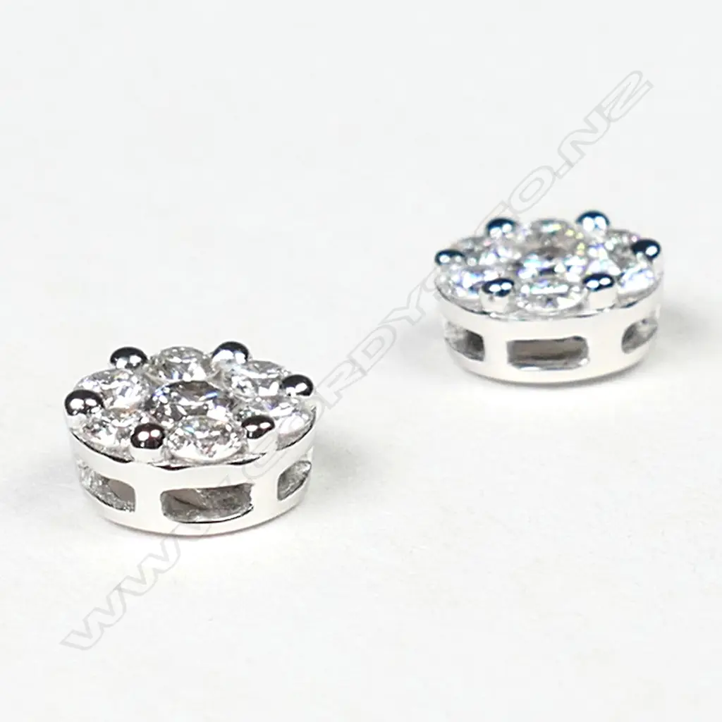 A pair of 18ct white gold and diamond cluster earrings, Image 1++