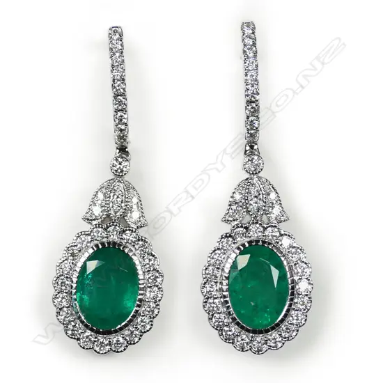 A pair of 18ct white gold, emerald and diamond drop earrings,