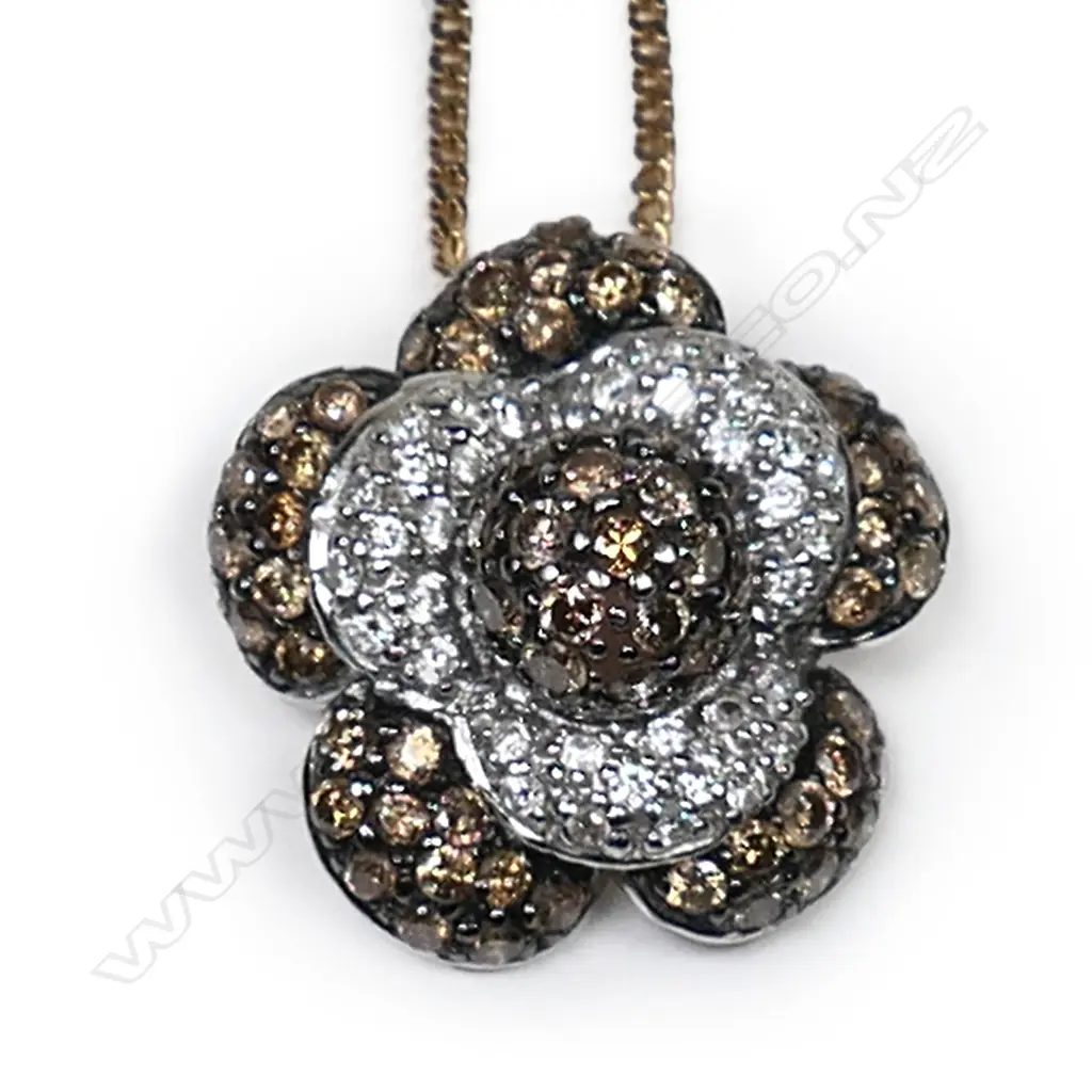 A 14ct white gold and diamond pendant, Image 1++