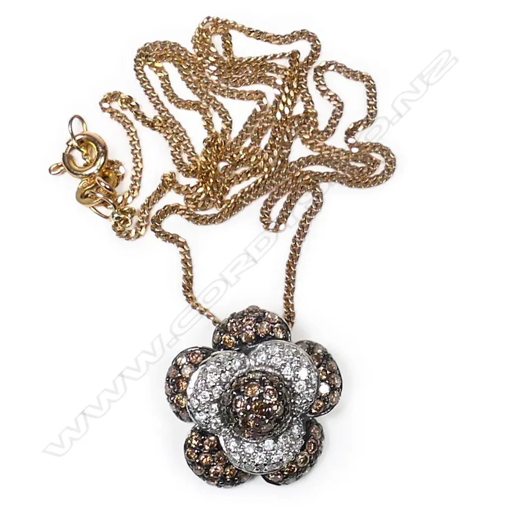 A 14ct white gold and diamond pendant, Image 1++