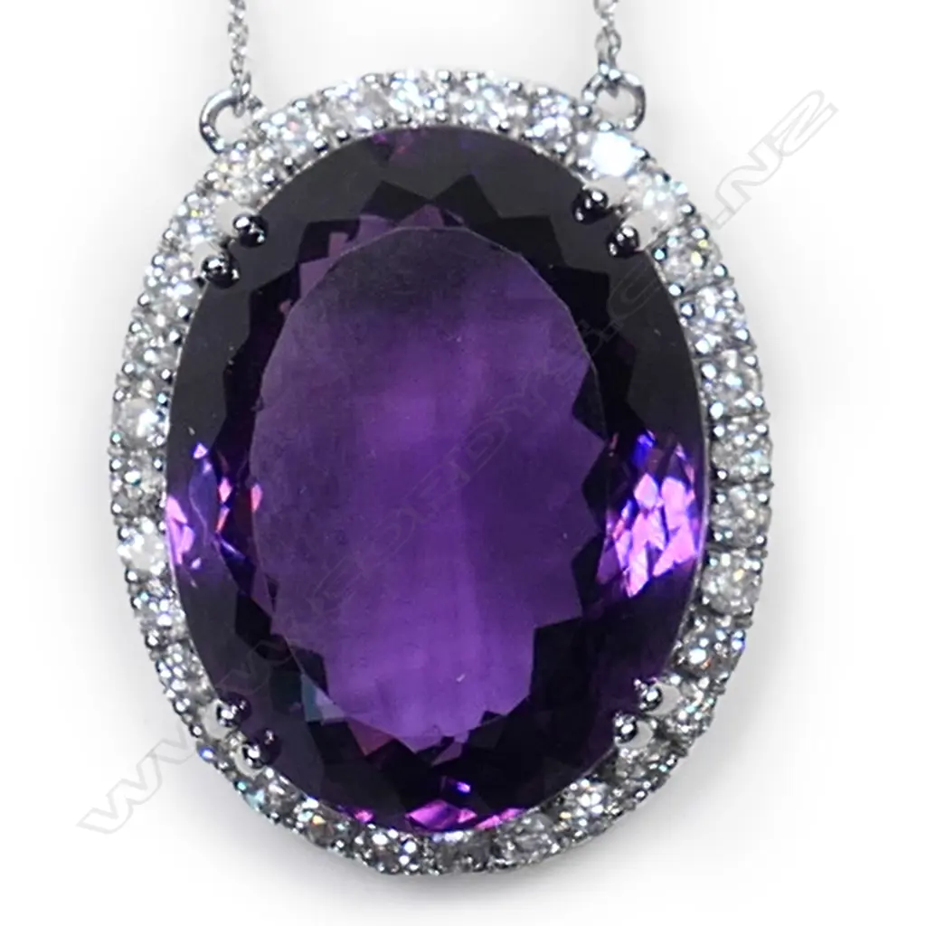 A 10ct white gold, amethyst and diamond halo pendant, Image 1++