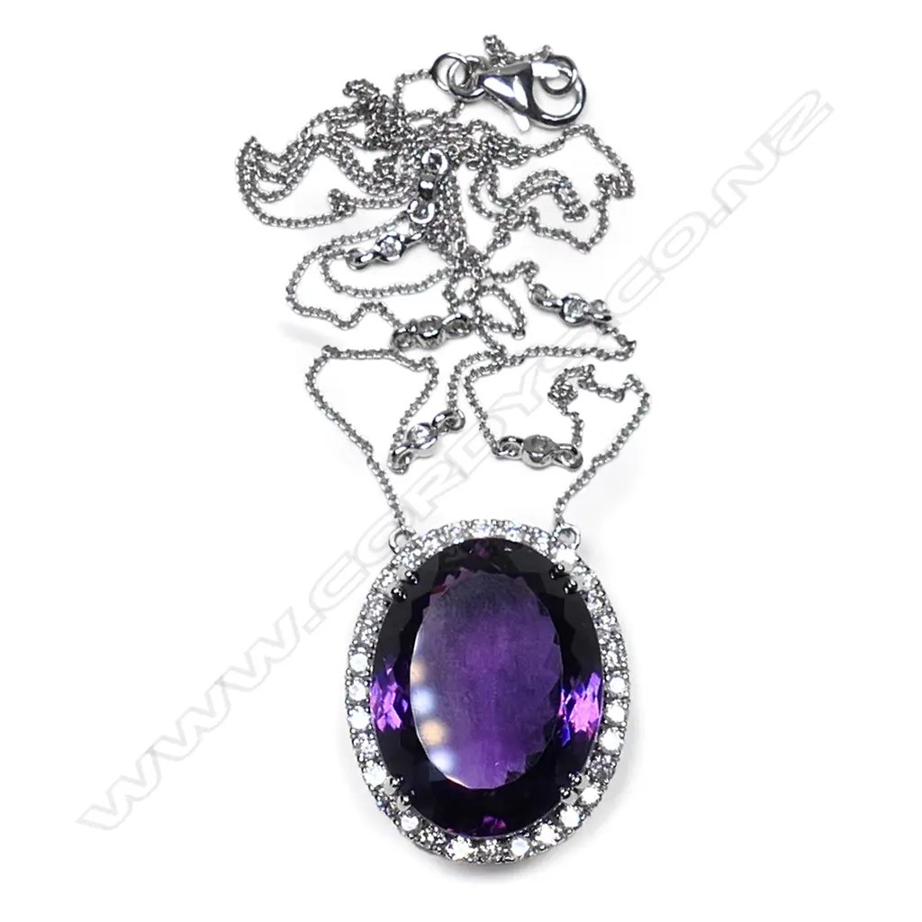 A 10ct white gold, amethyst and diamond halo pendant, Image 1++