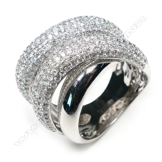 An 18ct white gold and diamond designer four band ring,