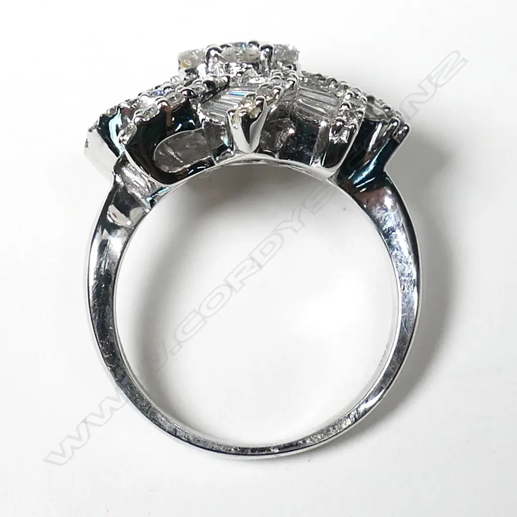 A modern designer large 18ct white gold and diamond cluster ring, Image 1++