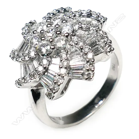 A modern designer large 18ct white gold and diamond cluster ring,