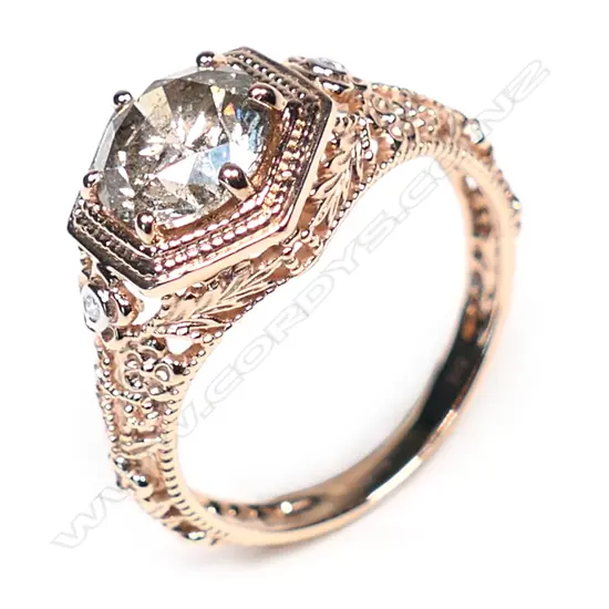 A 14ct rose gold and champagne diamond antique style ring,