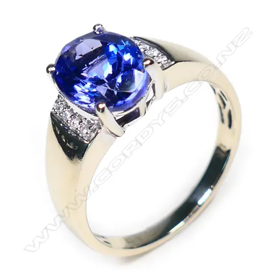 An 18ct white gold, tanzanite and diamond ring,