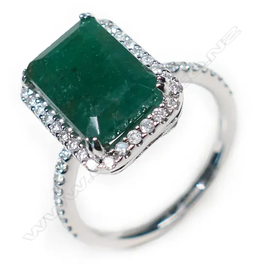 A 14ct emerald and diamond cluster ring,