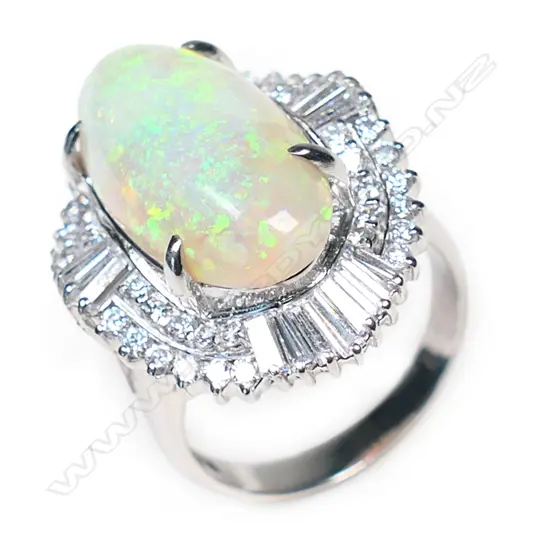A platinum, opal and diamond dress ring,