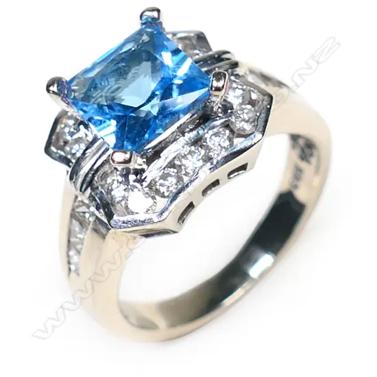 A 14ct white gold, topaz and diamond ring,