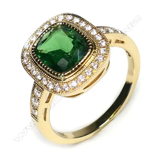 An 18ct gold Tsavorite garnet and diamond ring,