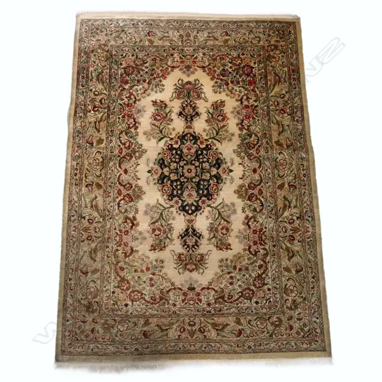 An Iranian Qum all-silk hand knotted rug, with a central rose medallion pattern,