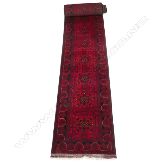 An Afghan Khamyab long runner, finely hand knotted, geometric patterned