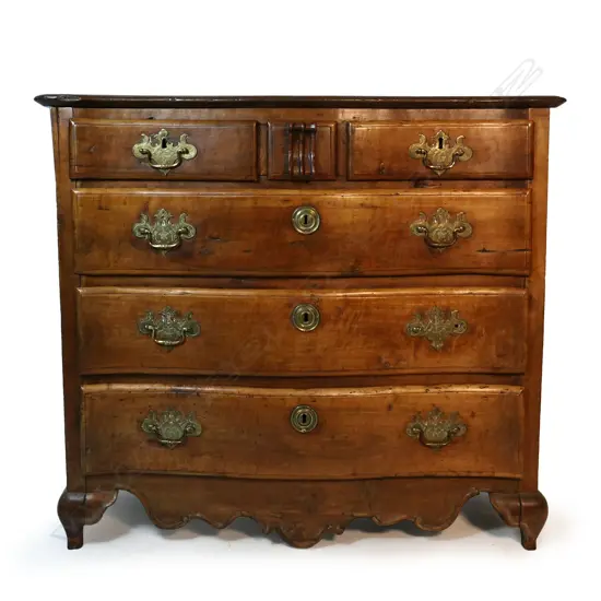 A 19thC French provincial large fruitwood commode,