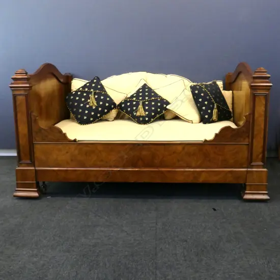 A European batteau lit daybed, with upholstered mattress and shaped back cushions,