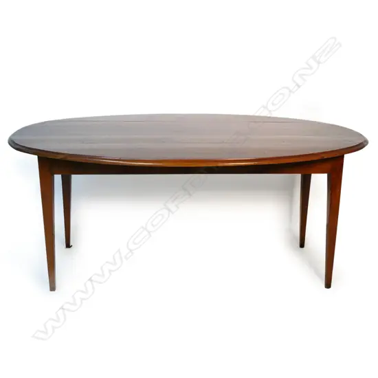A 19thC French oval, fruitwood plank top table,
