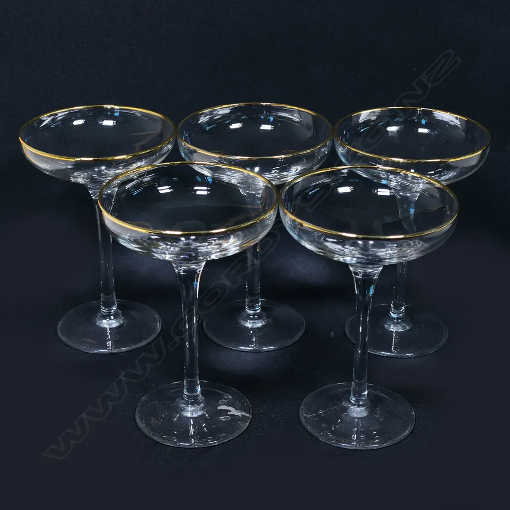 A set of  five gold rimmed champagne coupes Image 1++