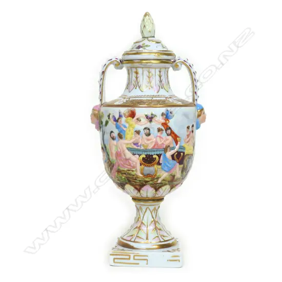 A small Italian Capo-di-monte porcelain two handled urn and cover