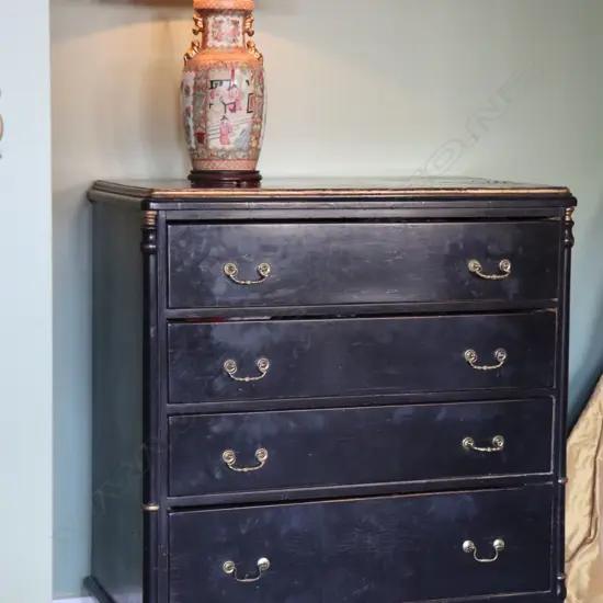 A French Empire ebonized flat front commode of four drawers,